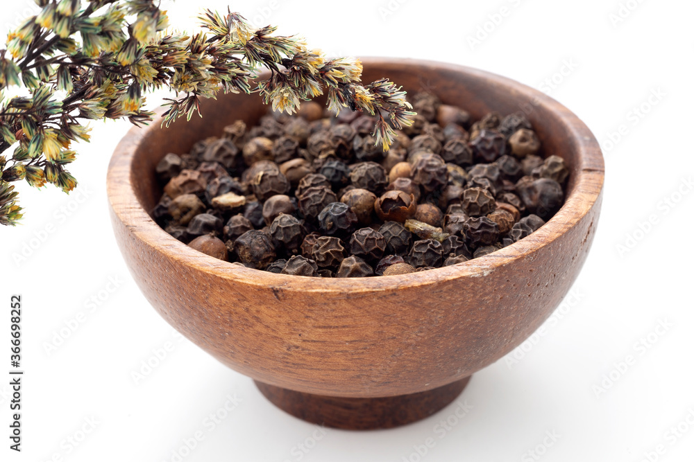 Thyme grains in white background and wooden presentation bowl Thyme grains in white background and wooden presentation bowl