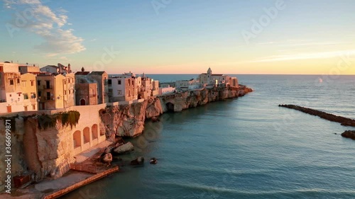 Wonderful evening cityscape of Vieste - coastal town in Gargano National Park, Italy, Europe. Coloful spring sunset on Adriatic sea. Full HD video (High Definition).
