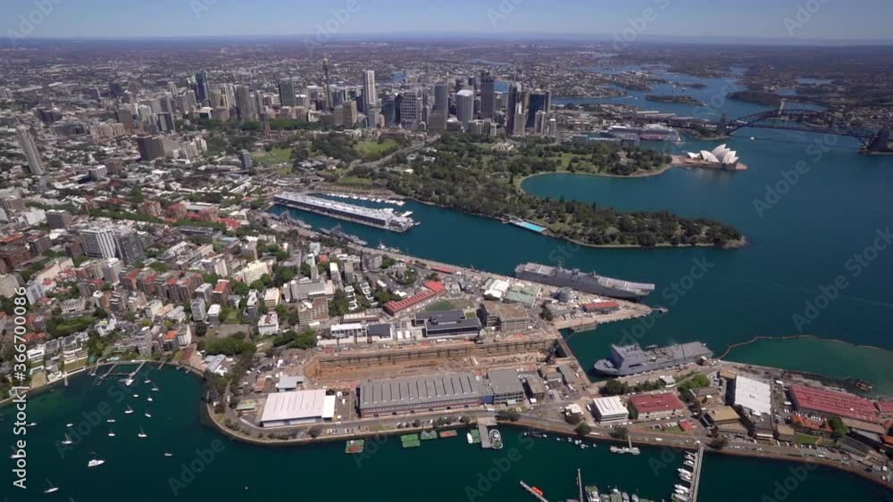 Aerial out of helicopter over sunny Sydney Opera House and Harbour Bridge Aerial out of helicopter over sunny Sydney Opera House and Harbour Bridge