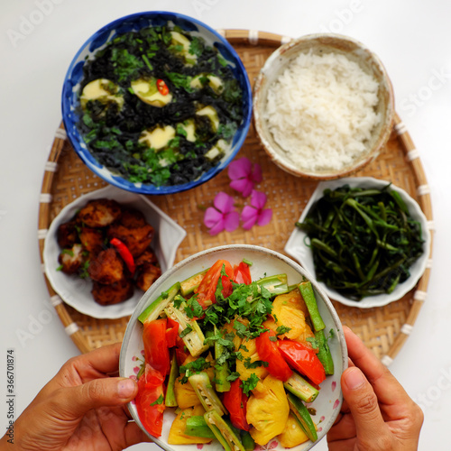 Vietnamese vegan cuisine, daily meal, seaweed, tofu soup, fried vegetables, dried bread cook with sauce, boiled water spinach