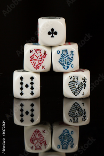 Straight Flush Playing Casino poker dice closeup Isolated on Black background. Abstract Pattern