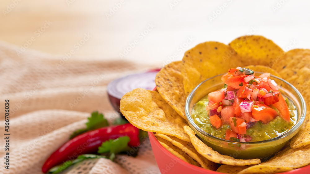 Mexican authentic homemade Guacamole with corn nachos chip traditional fresh healthy appetizer dip sauce for vegan Mexican authentic homemade Guacamole with corn nachos chip traditional fresh healthy appetizer dip sauce for vegan