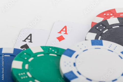 Pocket Aces  Hand Pair  Two Playing Cards and various color Poker Chips. Pattern Isolated on White Background.