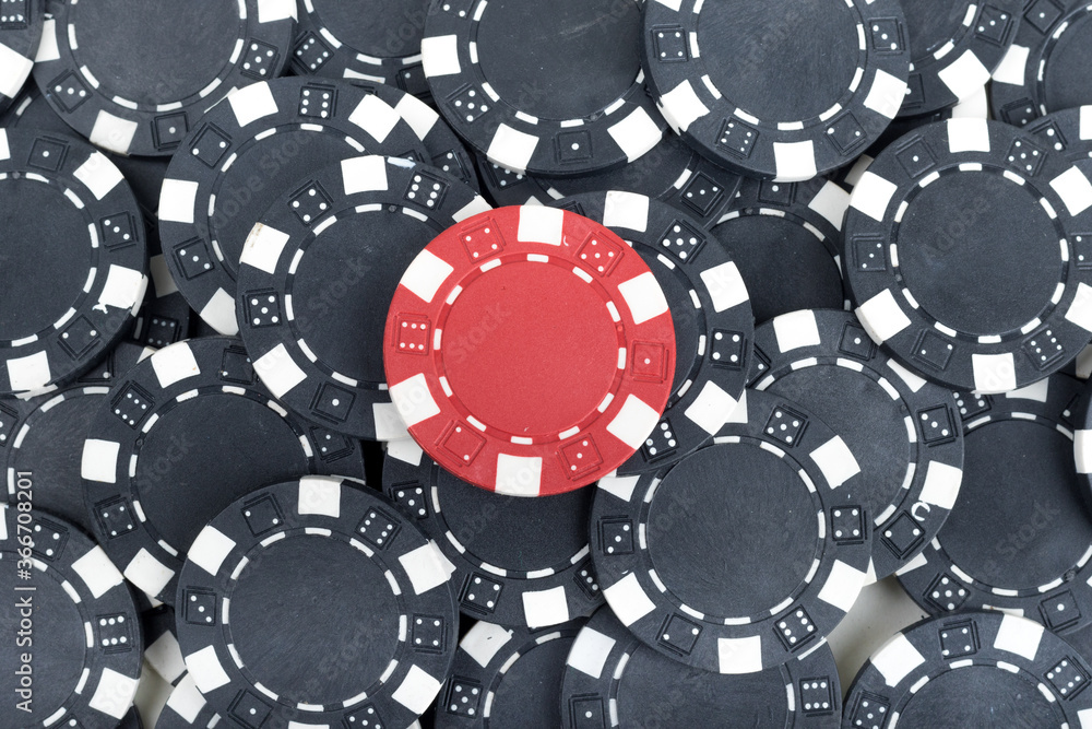 Battle Red versus Black yin vs yang Playing Poker Chips laying on the table mixed together. Abstract Pattern Background Battle Red versus Black yin vs yang Playing Poker Chips laying on the table mixed together. Abstract Pattern Background