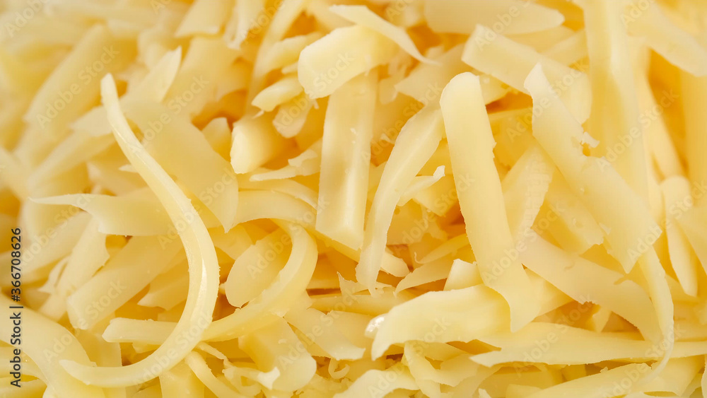 grated cheese top view, close up grated cheese top view, close up