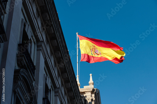 spain flag against blue sky