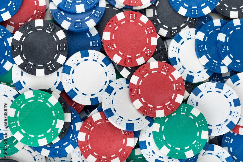 Playing Poker Chips laying on the table mixed together. Abstract Pattern Background Playing Poker Chips laying on the table mixed together. Abstract Pattern Background
