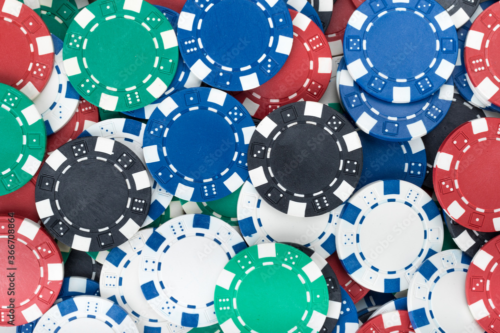 Playing Poker Chips laying on the table mixed together. Abstract Pattern Background Playing Poker Chips laying on the table mixed together. Abstract Pattern Background