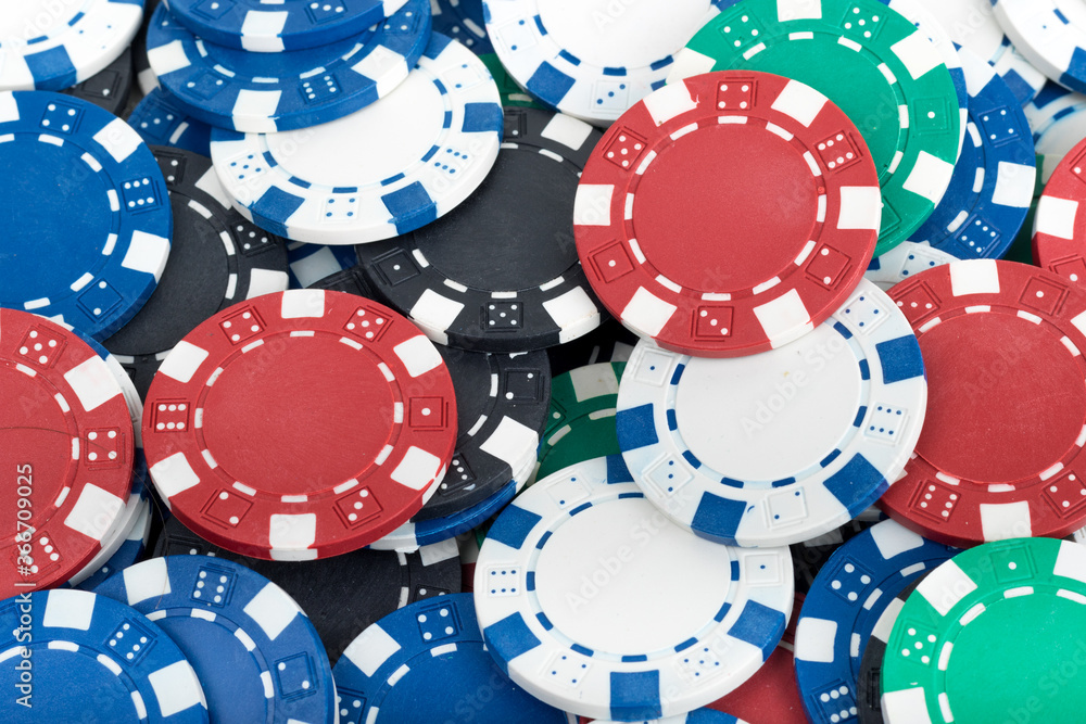 Playing Poker Chips laying on the table mixed together. Abstract Pattern Background Playing Poker Chips laying on the table mixed together. Abstract Pattern Background