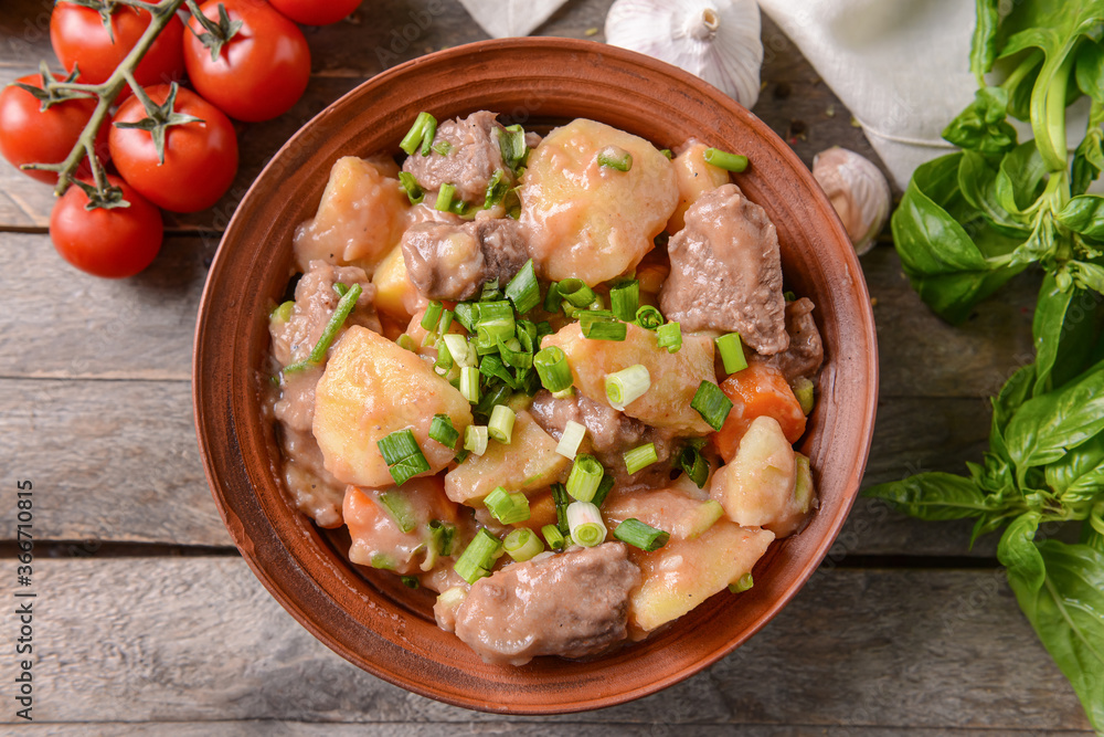 Bowl with tasty beef stew on table Bowl with tasty beef stew on table