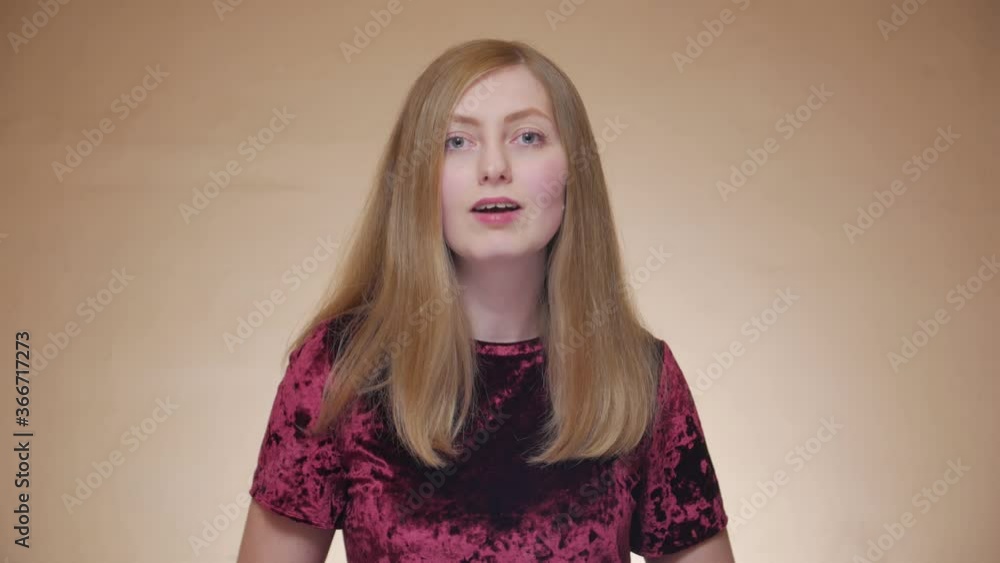 The back vocalist sings front portrait girl with braces singing dancing swaying looking at camera caucasian white 30 years The back vocalist sings front portrait girl with braces singing dancing swaying looking at camera caucasian white 30 years