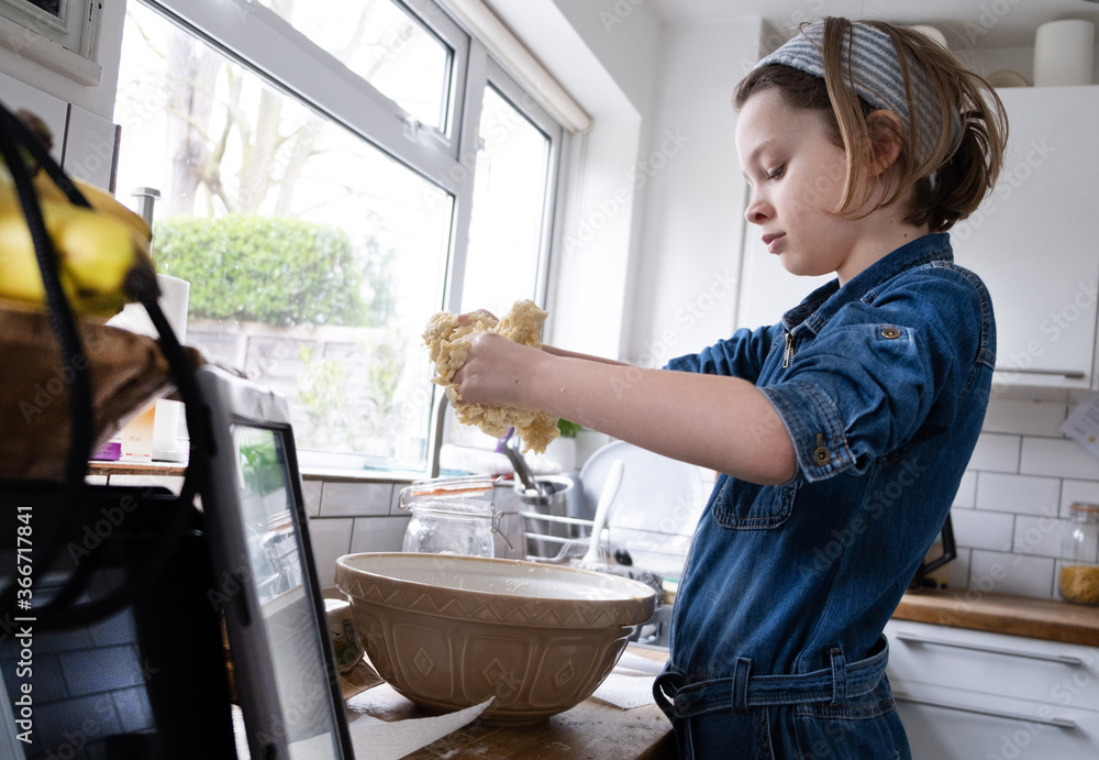 little girl in the kitchen making a cake little girl in the kitchen making a cake