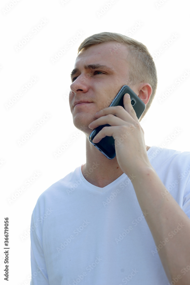 Portrait of young blond man against view of the clear sky Portrait of young blond man against view of the clear sky