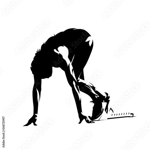 Sprinter kneeling in blocks