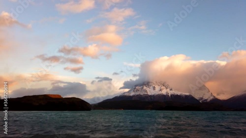 Mount Cerro Payne Grande and Torres del Paine at sunset time lapse. Nordenskjold Lake in Chile, Patagonia. photo