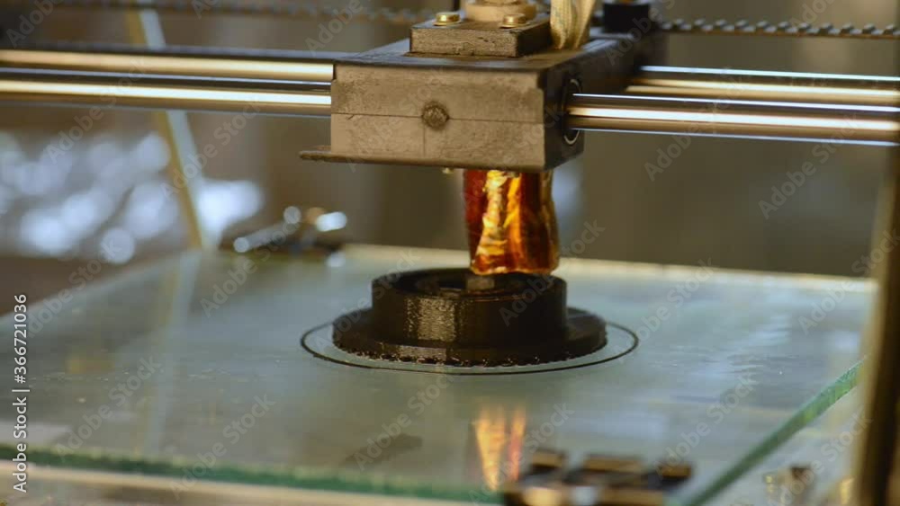 3D printer working. Fused deposition modeling. 3D printer working. Fused deposition modeling.