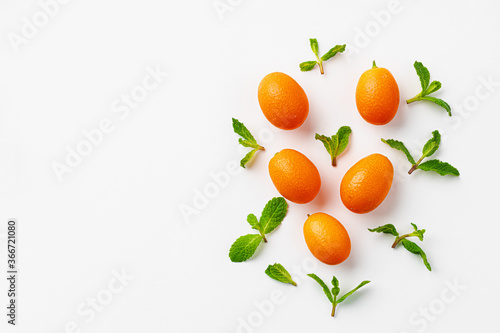 Top view of kumquat fruit on white background