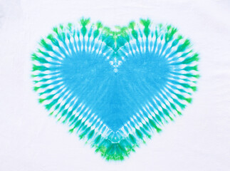 heart sign tie dye pattern on cotton fabric background.