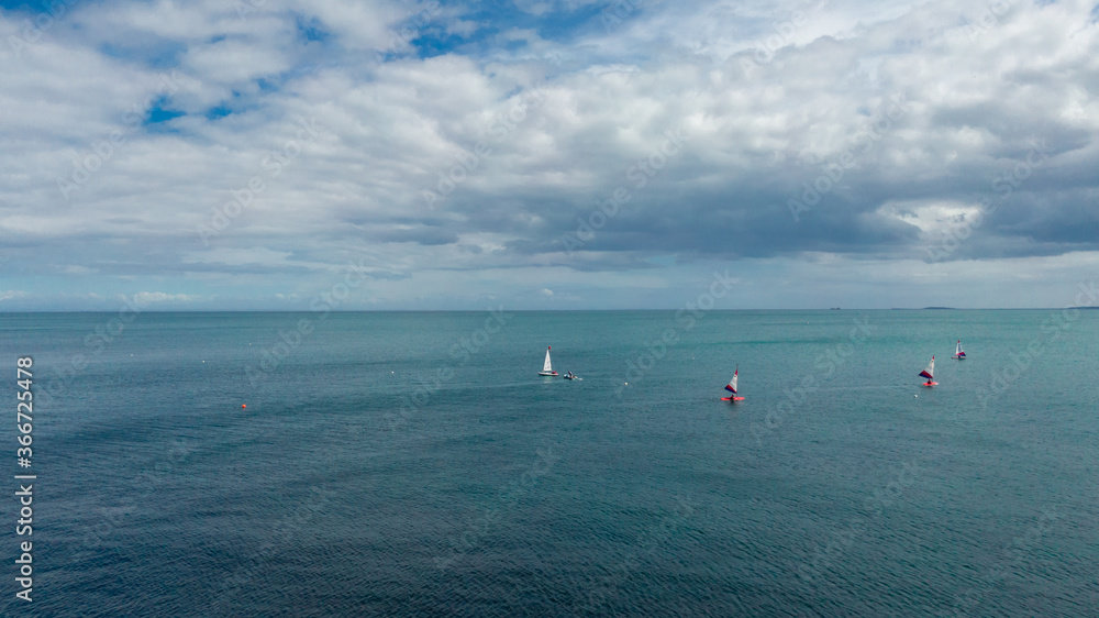 Aerial view on the windsurfers. Sea from air. Summer seascape from drone, Famous place in Whitehead, Northern Ireland, united Kingdom 