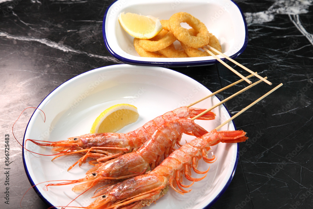 Beer pub. Seafood snack for beer. Langoustines, beer, squid rings.
Beer pub. Seafood snack for beer. Langoustines, beer, squid rings.
