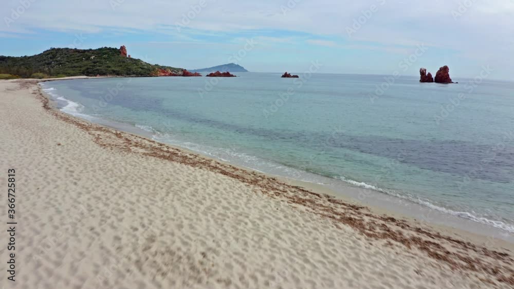 View from flying drone. Wonderful summer view of di Cea beach with Red Rocks Gli Scogli Rossi - Faraglioni. Aerial morning scene of Sardinia island, Italy, Europe. 4K video (Ultra High Definition). View from flying drone. Wonderful summer view of di Cea beach with Red Rocks Gli Scogli Rossi - Faraglioni. Aerial morning scene of Sardinia island, Italy, Europe. 4K video (Ultra High Definition).
