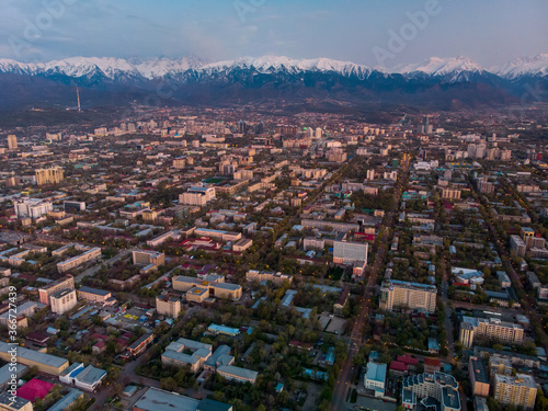Fototapeta Naklejka Na Ścianę i Meble -  Evening landscape of Almaty city with a view of the mountains