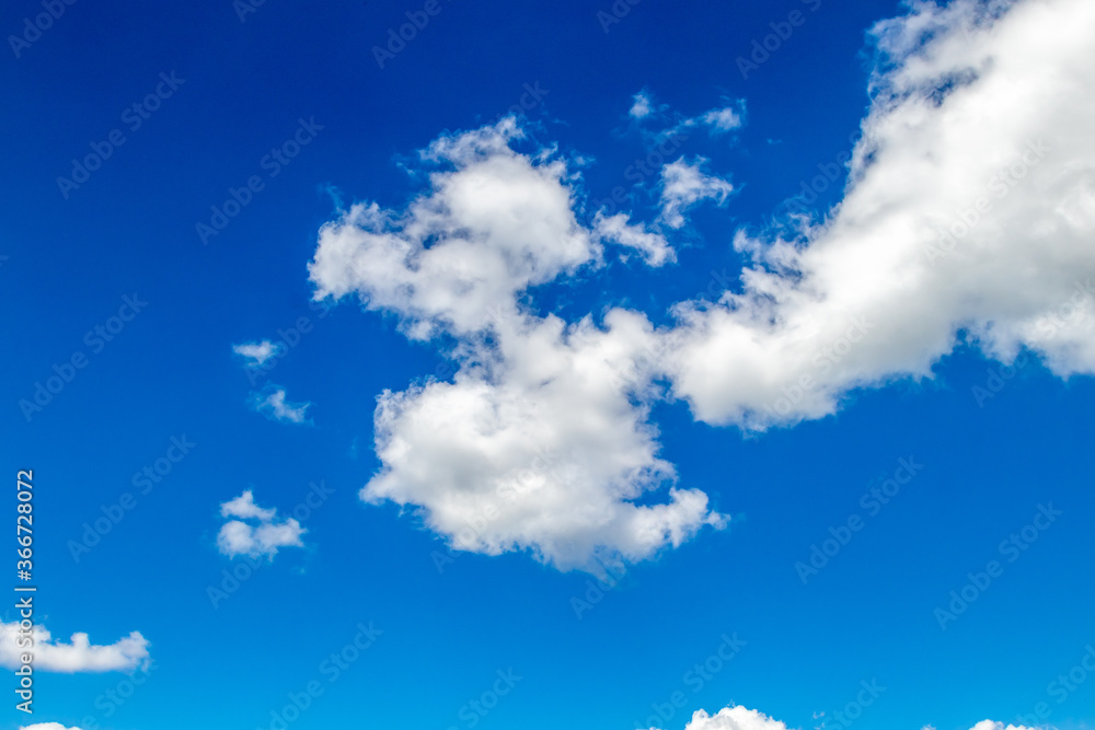 White and grey clouds on a blue sky