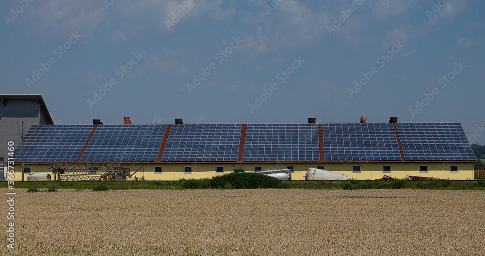 A very large photovoltaic system on an agricultural building. With six large units.