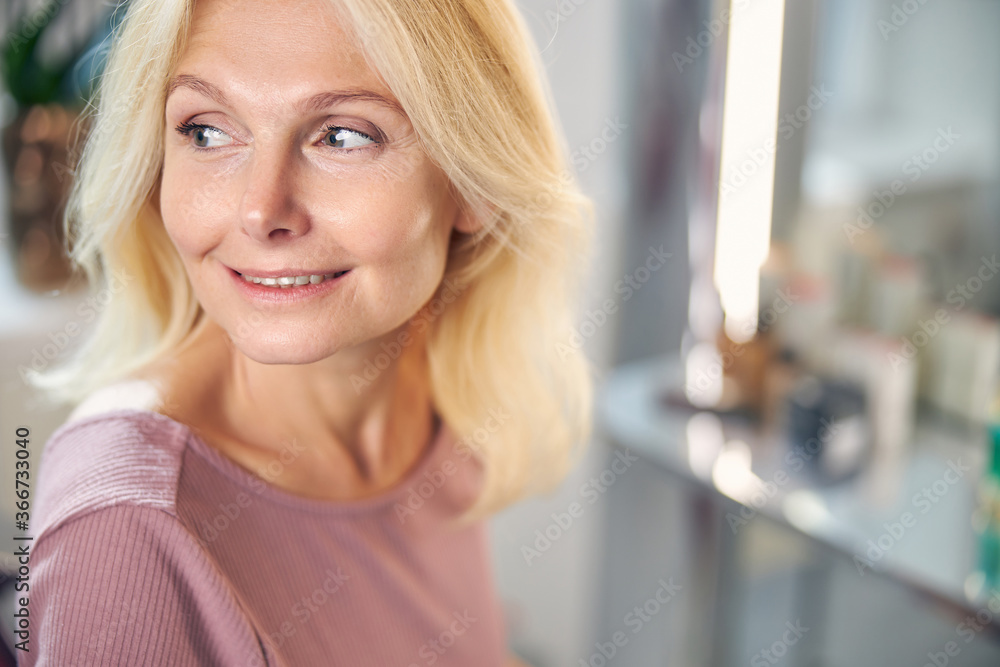 Portrait of pretty woman looking aside at window Portrait of pretty woman looking aside at window