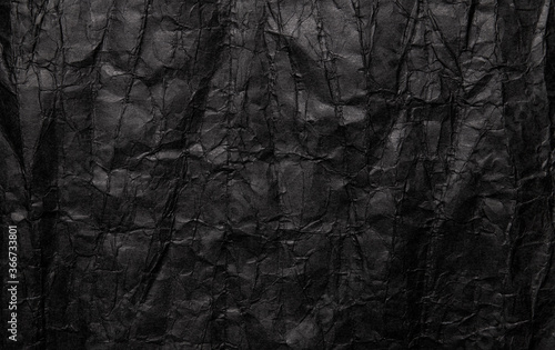 Black crumpled paper texture, grunge background