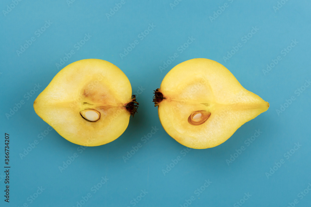 Yellow pears on blue background