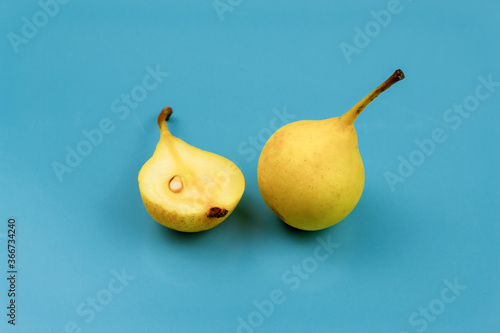 Yellow pears on blue background