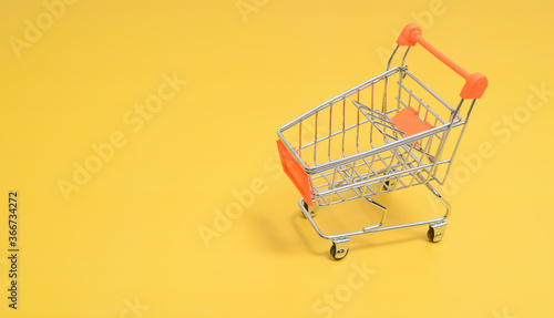 Trolley on yellow background.
