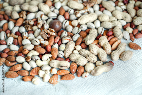 Assorted nuts for a background
Almond, walnut,cashew, pistachios, hazelnuts, peanuts, Macadamia
Collection of different varieties of nuts. Composition with dried fruits
Healthy food. Organic.