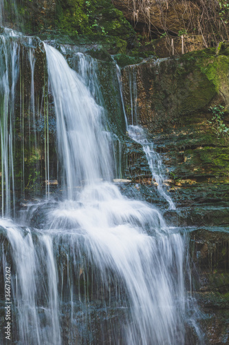 Fototapeta Naklejka Na Ścianę i Meble -  Majestic waterfall in deep forest. River forest scene. Wild, vivid vegetation. Beautiful landscape in Sintra, Portugal