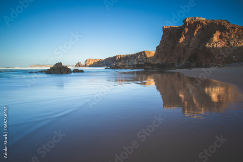 Magical beautiful Sunset at Rocky beach with Blue Ocean. Coastline landscape. Beautiful Scenic View. Sagres, Portugal