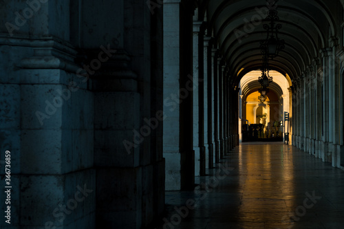 Abstract bottom view of the inside arch with spots of sunlight during sun rise. Detail of the Augusta Street triumphal arch  Arco do Triunfo  in the city of Lisbon  Portugal.