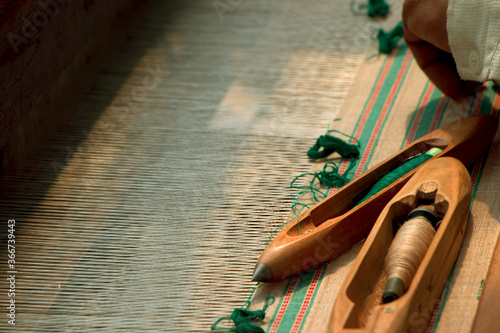 hand weavers using machine and spinning tools 