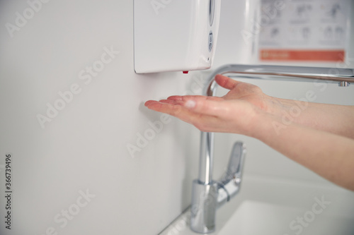 Close up of medical worker washing hands