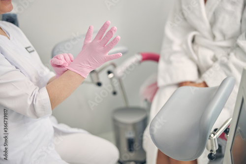 Close up of gynecologist who wearing sterile gloves