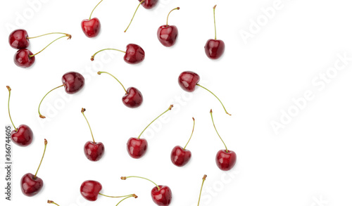whole ripe red juicy sweet cherries isolated on a white background, top view, flat lay