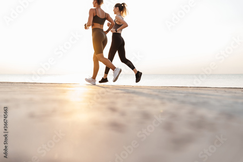 Fitness sports women friends running outdoors