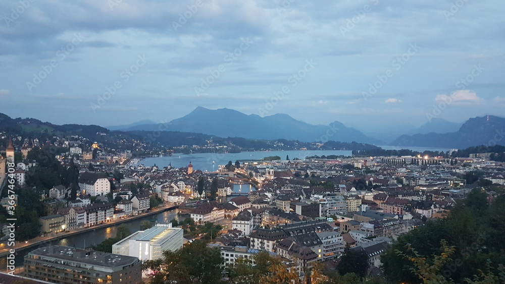 Sunset, evening, night Lucerne city aerial view from Château Gütsch in summer, a historic château (castle) in Lucerne, Switzerland, panorama of the city