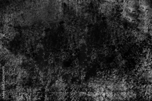 The concrete wall is gray with black spots, aged by time . Texture or background