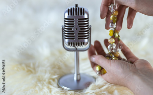asmr microphone with hands and beads