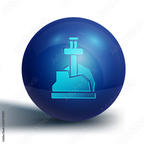 Blue Sword in the stone icon isolated on white background. Excalibur the sword in the stone from the Arthurian legends. Blue circle button. Vector.