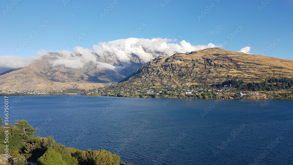 Lake Wakatipu with mountain view and clouds in summer, located in the southwest corner of the Otago region, in the South Island of New Zealand Lake Wakatipu with mountain view and clouds in summer, located in the southwest corner of the Otago region, in the South Island of New Zealand