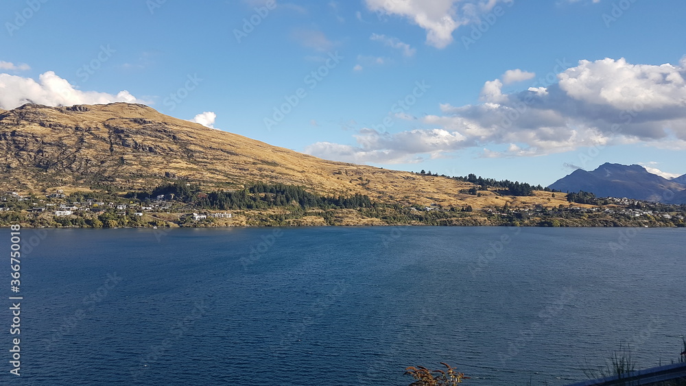 Lake Wakatipu with mountain view and clouds in summer, located in the southwest corner of the Otago region, in the South Island of New Zealand Lake Wakatipu with mountain view and clouds in summer, located in the southwest corner of the Otago region, in the South Island of New Zealand