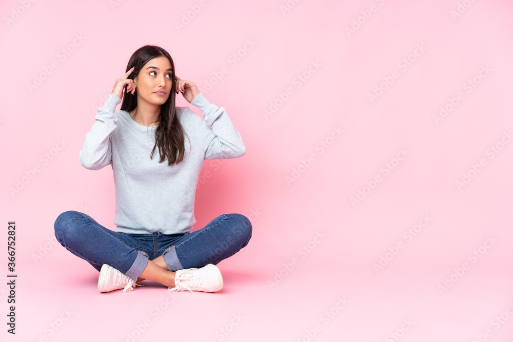 Young caucasian woman isolated on pink background having doubts and thinking Young caucasian woman isolated on pink background having doubts and thinking
