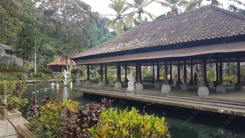 Obraz premium Gunung Kawi Sebatu Temple with water, pond view in summer, one of the least visited temple, located in Bali Island, Indonesia
